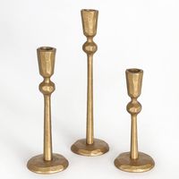 PRICES MAY VARY. The Revere Candlesticks combine an abstract molded shape and antique brass finish to create an imperfect statement piece. Each one varies slightly in design and has slight imperfections to give it character and style. Add these to your mantle, bedroom, living space or dining room for a bold and beautiful accent Authentic wrought iron candle holder set made with traditional blacksmithing tools and methods. Their organic shape and texture illustrate the true beauty of forged steel