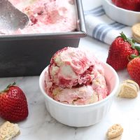 Creamy and delicious Strawberry Cheesecake Ice Cream you can make without an ice cream machine! This homemade ice cream is incredible and so easy to make!