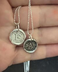 Tell your story with silver initials.  Each one is unique and hand torched and finished. 