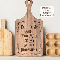 "This listing is for one Wooden Cutting Board Walnut Chopping Board Engraved Kitchen Witch Unique Cutting Board Hostess Gift Housewarming Gift for Roommate .  Introducing our \"Keep It Up And You Will Be My Secret Ingredient\" hardwood cutting board, made especially with the cooking enthusiast in mind. Perfect for any recipe, this board has got you covered for all your chopping needs. Surprise your special someone with the perfect kitchen gift - or treat yourself to one, nothing beats a trusty h