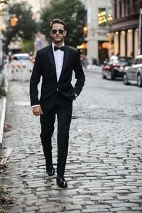 This is a Designer Tuxedo Suit crafted from high quality fabric and imported materials. Our products are handcrafted by experienced tailors who make sure the that the stitching is precise, lining is proper and the overall product is sturdy enough to not go out of shape for more than a few years. Also all our products have extra margins in their length, sleeves, sides so it's easily alterable if your size changes after some time. To see more available colours and designs in this collection, Check