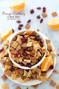 Orange and Cranberry Chex Mix is super delicious and dangerously addictive! It's an easy, oven baked chex recipe that's great for sharing with friends! #chexmixrecipe #ovenchexmix #cranberryorangechexmix #easysnackrecipe #easypartyrecipe #homemadechexmix