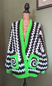 Granny hexagon cardigan with skull pockets, 100% acrylic yarn.  Fits up to a size 2XL.