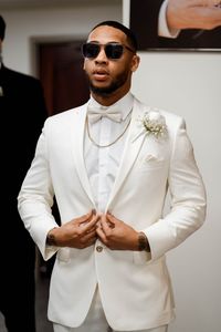 Looking for the perfect men's wedding suit? A white tuxedo might be your answer. Discover stylish and sophisticated white tuxedo ideas for grooms, ensuring you look sharp on your big day. Men's grooms getting ready photos on his wedding day