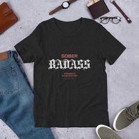 Make a bold statement with this *Sober Badass* T Shirt! Featuring the powerful message *'Sober Badass - Dominate Your Destiny'* in sharp, bold lettering, this t-shirt is a reminder of your strength and determination to take control of your life. Made from premium, soft fabric for all-day comfort, it’s perfect for celebrating your journey, inspiring others, or simply owning your power. Whether you’re at a recovery event or rocking it in everyday life, this tee is a reminder that your destiny is in your hands. Show the world what true resilience looks like and own your journey, one badass decision at a time!