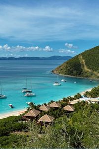 Escape to white sand beaches, gorgeous weather and turquiose blue oceans with our guide to where to stay in British Virgin Islands. This is one of the most underrated places to travel but it deserves to be on your summer bucket list. Whether it's the main island Tortola, or tiny tropical islands like Jost Van Dyke or Anegada, here are the island's best offerings, accomodation tips, what to do on each island & essential travel hacks. Dive into the clear waters of the Virgin Gorda Baths, relax on the pristine Tortola beaches like Smugglers Cove & Cane Garden Bay, and wander local markets. where to stay in bvi | things to do in bvi | things to do in british virgin islands | tortola bvi | virgin gorda bvi | british virgin islands aesthetic | british virgin islands sailing | tortola cruise port