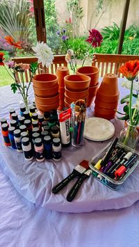 Party art activity idea, plant pot painting! The guests get to have fun, break the ice, and make something cute they can take home! #DIY #partyideas #partyactivities #DIYnight #fungroupactivity #unconventionalpartyideas #craft #craftnight