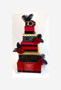 Introducing our exquisite 5 Tier RED, BLACK and GOLD Masquerade-themed Gift Card Holder Box, exclusively designed for your special occasions. This elegant gift card holder box is meticulously crafted to add a touch of opulence and sophistication to any celebration. Featuring a visually stunning cake-shaped design, this square-tiered masterpiece is adorned with vibrant red and black decorations, symbolizing passion and elegance. The intricate detailing showcases our unwavering commitment to quali