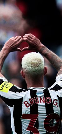 Newcastle United's Bruno Guimarães scores and celebrates against Brentford in Premier League