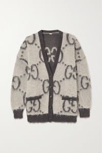 Gucci's oversized cardigan is intarsia-knitted with the instantly recognizable 'GG' motif and completely reversible, so you can choose between the fuzzy or smoother side. Inspired by vintage childrenswear, it's been made in Italy from mohair-blend in a neutral gray and ivory colorway. Wear yours with jeans or over a dress.