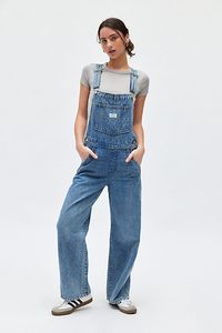 Updated Levi's® overall in a loose, slouchy fit. Designed in a classic, rigid denim featuring adjustable straps, functional pockets and a straight leg fit. Topped with button & buckle fastenings for a classic vibe. Features Levi's® full length baggy overall Denim jumpsuit Classic non-stretch denim Square neckline with buckle straps Front patch pocket with Levi's® patch Loose through the hips and thighs Straight leg Full length 4-pocket styling Button closure Content + Care 100% Cotton Machine wash Imported Size + Fit Model in Khaki is 5’9.5" and wearing size Small Measurements taken from size Small Waist: 30" Rise: 10" Length: 30" | Levi's Full Length Baggy Overall in Light Blue, Women's at Urban Outfitters