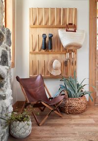 This storage rack on the wall makes for a fun design element, but it’s also actually really useful. Garden necessities like boots, hats and tools are important to have easily accessible for working in the garden.