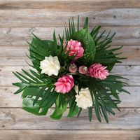 Send this mix of tropical flowers and make it feel like summer! Pink and white ginger with cute mini pineapples and palm leaves.