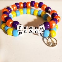 Adorable And Positive "Teach Peace" Double Strand Kandi Bracelet With A Peace Charm. Great For Music Festivals An Raves Bracelet Is 30 Beads Around Made With Jump Ring, White Letter Beads, Pony Beads, Elastic String Please See Photo For Size Comparison Of Charm Tags: Edc, Edm, Rave, Festival, Kandi, Plur, Kawaii, Kandi Bracelet, Single Kandi Bracelet, Peace, Beaded Bracelet, Word Bracelet, Peace Charm Bracelet, Letter Bead Bracelet, Kandi Raver, Beaded Charm Bracelet, Bracelet Set, Peace Kandi B