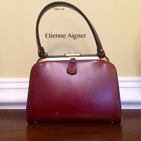 This is my Etienne Aigner purse. It's small, stiff and doesn't hold a lot, but it was one of my favorites. Either late 60s or 1970.