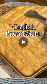 7.8K views · 3.4K reactions | These soft, garlicky breadsticks are one of my kids’ favorite side dishes—they absolutely LOVE when I make them! These were the first bread I baked when I was learning, and I remember being so proud of how they turned out. I don’t usually let the dough rise for these, but you can if you prefer.

I’ve listed the supplies I used on my Amazon storefront, and you can find the link in my profile. Let me know if you have any questions!

Ingredients:

2 Tbsp yeast
2 1/2 cups warm water
2 Tbsp sugar
2 Tbsp oil
1 Tbsp salt
6 cups flour
1/2 cup melted butter

Instructions:

	1.	Prepare the Dough:
	•	In a large mixing bowl, dissolve the yeast in warm water.
	•	Add sugar and let it sit for a few minutes until the mixture becomes frothy.
	•	Stir in the oil, salt, and flour