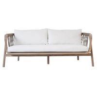 Our luxurious Outdoor Sofa boasts a stunning frame crafted from exquisite plantation teak wood in a reclaimed aged finish. With intricate taupe outdoor rope detailing on the back and sides, its captivating design creates a striking cross-decor pattern. #natural, #coastal, #outdoor, #sofa