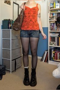 indie whimsical  fall outfit OOTD black boots tights with low rise shorts graphic tank