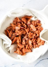 Get your bacon bits perfectly crispy AND know exactly what's inside by making them at home! Perfect to sprinkle on salads, pizza, casseroles, and soup! Here's How to Make Homemade Bacon Bits, with both stovetop and oven instructions! #baconbits #homemadebaconbits