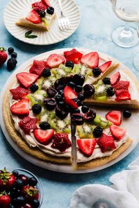 Fruit Pizza is the best summertime dessert! A thick & chewy sugar cookie is slathered with tangy cream cheese frosting and topped with plenty of fresh fruit. Use whatever fruit you love - you can even cut it into fun shapes like stars for Memorial Day or the 4th of July!