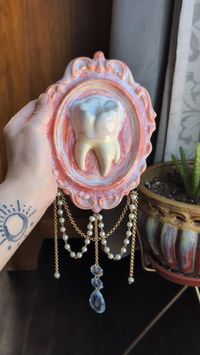 Aaaand then it broke 24 hour later 😭 Such is the life of a ceramicist. Definitely still cried though 😅 I have a green one left (sans chains) to bring to my next event in 2 ish weeks! _______ #pottery #ceramics #teeth #tooth #maximalist #maximalism #pastelgoth #ceramic #pearls #gold #pink #spooky