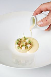 Matt Whitfield serves celeriac three ways in this celebration of the root vegetable; salt-baked, pickled and as a rich, buttery purée. The pretty vegetarian starter is finished with toasted hazelnuts, pickled celery and a rich truffle beurre blanc sauce.