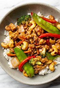 This spicy ground chicken stir fry recipe is a quick weeknight meal with a kick! It has a tasty Asian-inspired sauce that's made from scratch along with fresh vegetables.