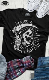 Sick of people wishing you a "blessed day?" Turn the tables with this funny grim reaper shirt. Our ironic grunge horror shirt makes a great gift for anyone who loves Halloween, dark humor, skeletons, or skulls. Scare the righteous to death with this funny goth shirt. #Boredwalktshirts #Haveacursedday #FunnyHalloweenshirt #Grimreapershirt #Tattooartshirt #Darkhumortees #Gothstyle #Bikerstyle #Halloweengift