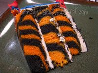 Tiger Cake Slice by gemcitykitty, via Flickr. Maybe shark decorations with Tiger interior!