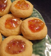 A savory take on the classic thumbprint cookies.  Cheese straw dough shaped into thumbprints and filled with pepper jelly.