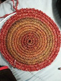 Crochet around clothesline rope to make a rug or hot pads.