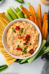 Pimento Cheese Dip is a classic southern recipe that's rich, creamy, and easy to whip up. This "caviar of the south" is the perfect dip for crackers or veggies, and tastes heavenly on burgers, sandwiches, and even grilled cheese. #pimentocheese #dip #appetizer #recipe belleofthekitchen.com