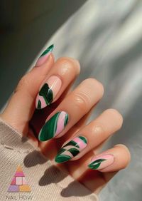 Sleek and modern, these green and pink nail designs are a chic twist on the classic French tip. The clean lines and leafy patterns offer a different nail design on each nail, making it a fashionable choice for short nail designs. Explore nailhow.com for more designs that blend sophistication with a pop of nature.