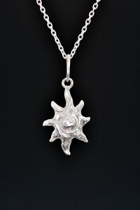 "A hand carved and cast sculptural little sun pendant makes the perfect goddess necklace. Over sized hammered bail. On a short delicate cable chain with an S hook clasp to secure. Bright shiny sterling silver. Each is handcrafted individually by the artist, Miche McClendon, in her Laguna Beach studio/gallery. The sun represents life, divinity, clarity, illumination and constancy. In alchemy it is associated with gold, purity and masculine energy. It symbolizes the perfection of all matter on any