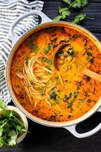 Cozy and comforting, this Chickpea Coconut Curry Noodle Soup has a red curry coconut broth and is filled with veggies, chickpeas & noodles!