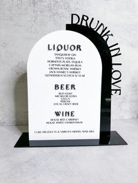 DETAILS: 3mm Acrylic Stand included Engraved Drink Menu.  Please know Liquor, Beer and Wine is cut out separate and attached as a 3D text in above example This bar sign in example is 13 in high x 11 in wide Fonts used:  Drunk in Love/Liquor/Beer/Wine - Brown Sugar Bar Menu Items - Alta Regular CUSTOMIZE: You can custom the background acrylic words on the side of arch - ie. Drunk in Love, Signature Drinks. A rendering will be send prior to production. Feel free to message me - I love custom orders. Made to order and can be customized - Do you have your own wedding font? Message us! STAYING CONNECTED: Instagram: @shoptheweddingconcept TikTok: @shoptheweddingconcept