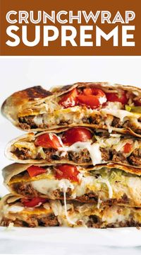 Crunchwrap Supreme! OMG. Layers of taco meat, queso, tostada, lettuce, tomato, salsa, hot sauce, and sour cream. Yes please! #taco #texmex #recipe #food | pinchofyum.com