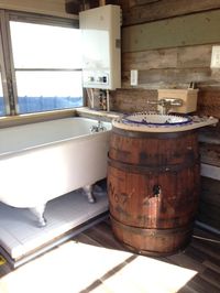 Love the barrel sink and tub in this converted school bus.