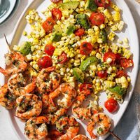 This recipe showcases the beautiful bounty of summer with its fresh corn, tomatoes and delicious basil. Prevent browning by spritzing the salad with lemon juice. —Deena Bowen, Chico, California