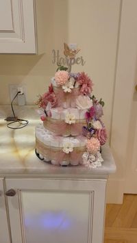 Butterfly Diaper Cake with approx. 80 diapers, silk flower and 3D butterflies. This was so fun to put together!