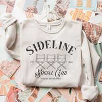 The sideline social club is where we're allllll at on saturday mornings, amirite mama? This trendy new design is available as a tee or crewneck and perfect for soccer games or the football field and celebrates the mamas that come together to cheer on their kiddos! DETAILS Unisex sizing - aka mens sizing. If you want a looser fit, we recommend ordering your normal size or one up for an oversized fit. If you prefer a more fitted style, size down one. Tee - 52/48 Airlume combed and ringspun cotton/polyester. Side seams, shoulder to shoulder taping, tearaway label. Crewneck - raglan or drop shoulder sleeves with side seams, ribbed cuffs and ribbed waistband. Heather Dust tee or crewneck with black print