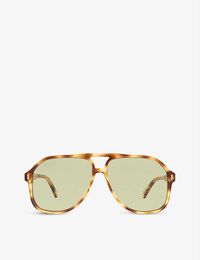 Even if you fancy yourself a minimalist, it's difficult to resist the charm of Gucci's statement accessory line. Take these sunglasses, for instance. Crafted from sturdy (and comfy) acetate, they're moulded into wide aviator shaped lenses that hide a manner of sins on early morning milk runs. Topped with gold tone hinges, this style is engraved with the Italian label's signature logo at the temples, dotted in a contrasting tortoiseshell.Gucci acetate sunglasses100% acetateStyle number: GG1042STo