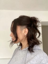 Medium brown hair with sidecut