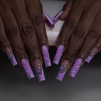 This purple fall nails design is all about floral fantasy. The nails feature a nude base with intricate purple floral designs and embellishments. The combination of detailed floral art and subtle color palette makes this design elegant and eye-catching, perfect for those who appreciate intricate nail art.  Photo credit by: @nailtechkam