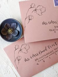 Personalize your special event with a handwritten calligraphy envelope that will set the tone for your guests. Say goodbye to boring wedding envelopes with these unique, modern yet classic floral wedding envelopes on dusty rose envelope.