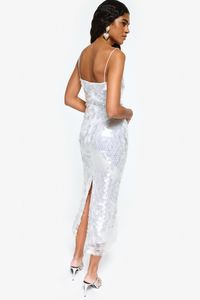 Translucent sequined fabric %100 Polyester Dry clean only Thin strapped Tight fitting Maxi dress Model is wearing size 36. Dress does not have any give in fabric, so recommend sizing up once if you are in between sizes. Dress Frontal Length from Shoulders: Standard Length: 140 cm Sensitive item, use with caution. As th