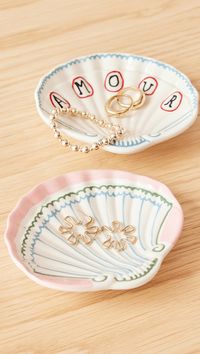 Find LAETITIA ROUGET Set Amour Shell Dishes on Editorialist. Glazed stoneware. Set of 2. Seashell silhouette. Dishwasher safe. Made in Portugal. Measurements: Width: 4.75in / 12cm Height: 4.25in / 11cm