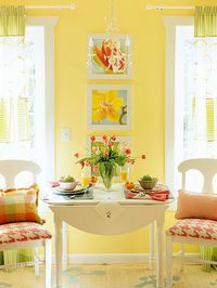 Fun and Functional. The dropleaf table and a pair of dining chairs fit perfectly between the two windows behind the sofa. //The orange & yellow are perfect in this photo.....