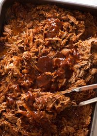 Large pan filled with Slow Cooker Pulled pork with BBQ Sauce