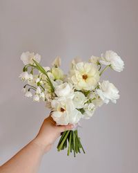 Is there anything cuter than a mini bouquet? So whimsical and fun for a bridesmaid in a garden party wedding!  Bouncy, light and airy, and perfect for bridesmaids that are wearing all different colors, this white bouquet compliments the bride and lets your color palette really shine.